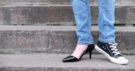 Photo of a Woman Wearing Two Different Shoes