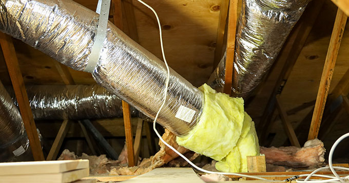 duct cleaning in Sarasota Florida - fiberglass ducts for central air conditioning in the attic